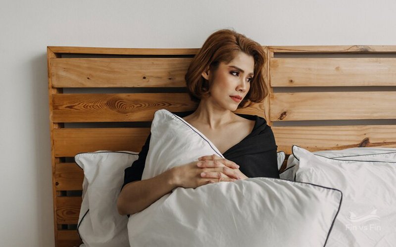 sad middle woman in bed